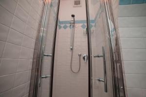 a shower with a glass door in a bathroom at Nonna Carmelina in Ravello