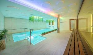 a large bathroom with a large swimming pool at Sono & SPA - Adults Only in La Garriga