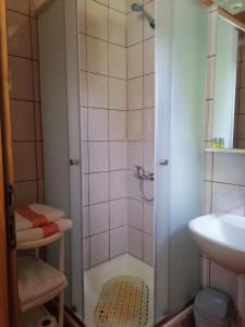a bathroom with a shower and a sink at House Jezerka in Jezerce +42 photos