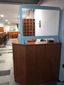 a view of the reception desk of a wine shop at Hostal Cal Siles in El Prat de Llobregat