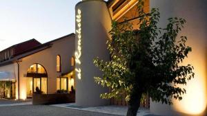 a building with a tree in front of it at Borgo Ronchetto in Salgareda