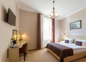 Ένα ή περισσότερα κρεβάτια σε δωμάτιο στο Belgrade City Hotel