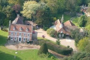 an aerial view of a large house in a field at Brackenborough Hall Coach House - Granary in Louth