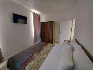 a bedroom with a large bed in a room at Apartments Tanja in Zavalatica