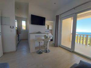 a living room with a view of a balcony at Apartments Tanja in Zavalatica