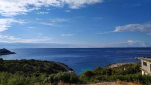 a view of the ocean from a house at Apartments Tanja in Zavalatica