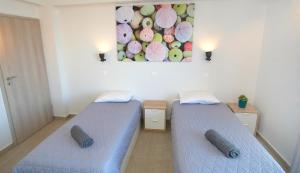 Posteľ alebo postele v izbe v ubytovaní Eva Villas West with infinity pool & and panoramic sea view
