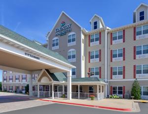 rendering hotelu z zajazdem na dziedzińcu w obiekcie Country Inn & Suites by Radisson, Bentonville South - Rogers, AR w mieście Rogers