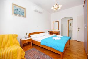 Postel nebo postele na pokoji v ubytování Apartmani Srzic + 37 fotografií