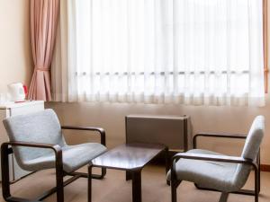 Posezení v ubytování Tabist Koboshi no Yu Senshintei Aizu Yunokamionsen