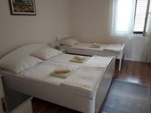 Postel nebo postele na pokoji v ubytování Apartments Verica