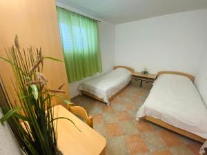 Postel nebo postele na pokoji v ubytování Apartments 'Stine'
