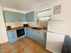 Kuchyň nebo kuchyňský kout v ubytování Apartments 'Stine'