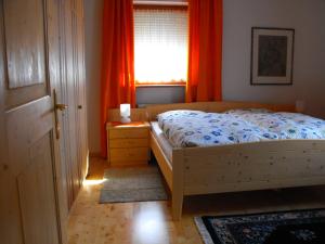 En eller flere senge i et værelse på Weingut Eberlehof