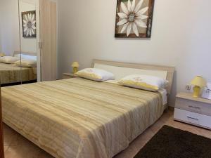 Posteľ alebo postele v izbe v ubytovaní Apartments & Room Piutti