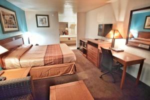 Letto o letti in una camera di Claridge Inn - St. George
