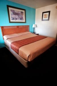 Letto o letti in una camera di Claridge Inn - St. George