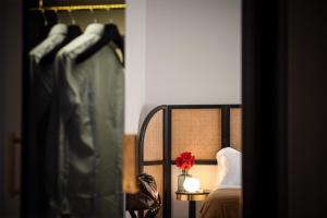 A bed or beds in a room at Magnolia Boutique Rooms