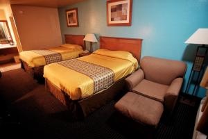 Letto o letti in una camera di Claridge Inn - St. George