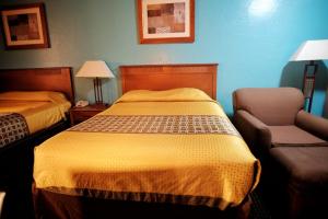Letto o letti in una camera di Claridge Inn - St. George