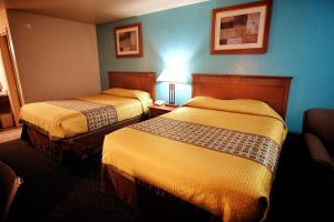 Letto o letti in una camera di Claridge Inn - St. George