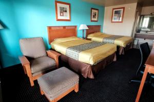 Letto o letti in una camera di Claridge Inn - St. George