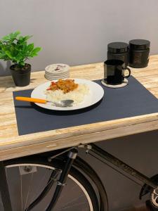 a plate of food on top of a table at Hostel Sova in Novi Sad