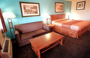 Letto o letti in una camera di Claridge Inn - St. George