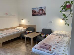 Posteľ alebo postele v izbe v ubytovaní Penzion MAR