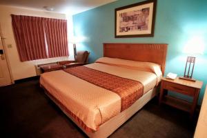 Letto o letti in una camera di Claridge Inn - St. George