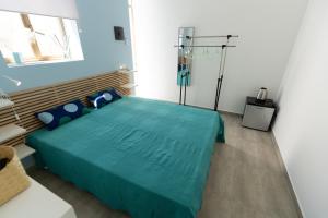 Postel nebo postele na pokoji v ubytování Venti di Brucoli