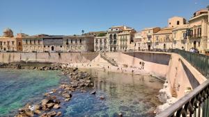 a group of animals in the water in a city at Il riad del capitano in Siracusa