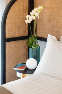 A bed or beds in a room at Magnolia Boutique Rooms