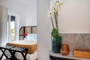 A bed or beds in a room at Magnolia Boutique Rooms