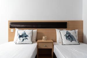 Postel nebo postele na pokoji v ubytování Pagona House