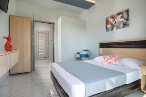 Postel nebo postele na pokoji v ubytování Pagona House