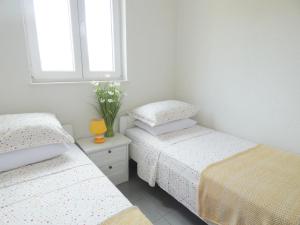 Postel nebo postele na pokoji v ubytování Apartments 'Stine'