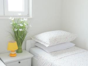 Postel nebo postele na pokoji v ubytování Apartments 'Stine'
