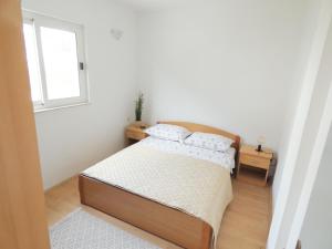 Postel nebo postele na pokoji v ubytování Apartments 'Stine'