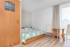 Postel nebo postele na pokoji v ubytování Paula