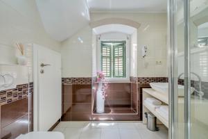 a bathroom with a shower and a sink and a toilet at Guesthouse Imperator in Split +56 photos