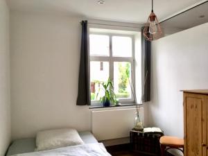 En eller flere senger på et rom på Maisonette Wohnung Südstadtvilla