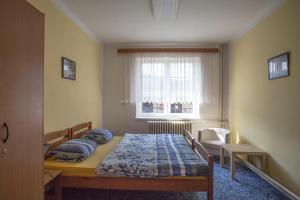 Postel nebo postele na pokoji v ubytování Ubytování na Broumovsku - Machov