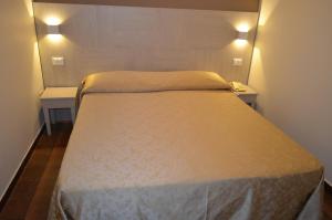 Postel nebo postele na pokoji v ubytování Hotel Paradiso Verde