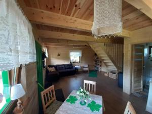 a living room with a couch and a table at GREEN HOUSE in Krasnopol