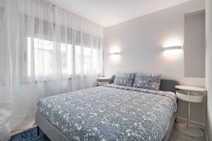 Ένα ή περισσότερα κρεβάτια σε δωμάτιο στο Comtal homey apartments