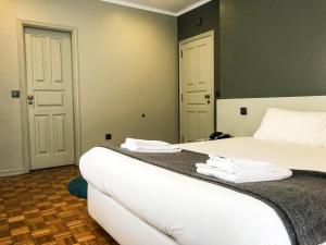 Un pat sau paturi într-o cameră la Hotel do Paço