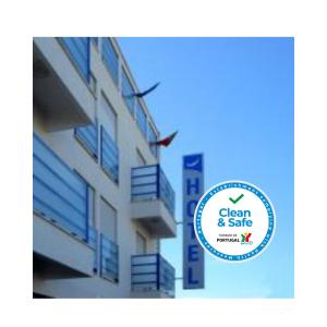 a sign for a clean and safe building at Hotel Sra da Conceicao in Praia de Mira