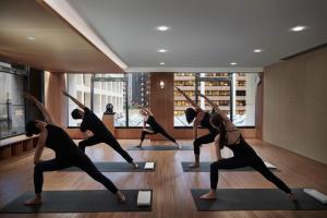 Fitnes oz. oprema za telovadbo v nastanitvi The Landmark Mandarin Oriental, Hong Kong