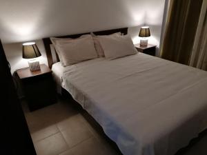 Postel nebo postele na pokoji v ubytování Stef Lux Home of Kriopigi
